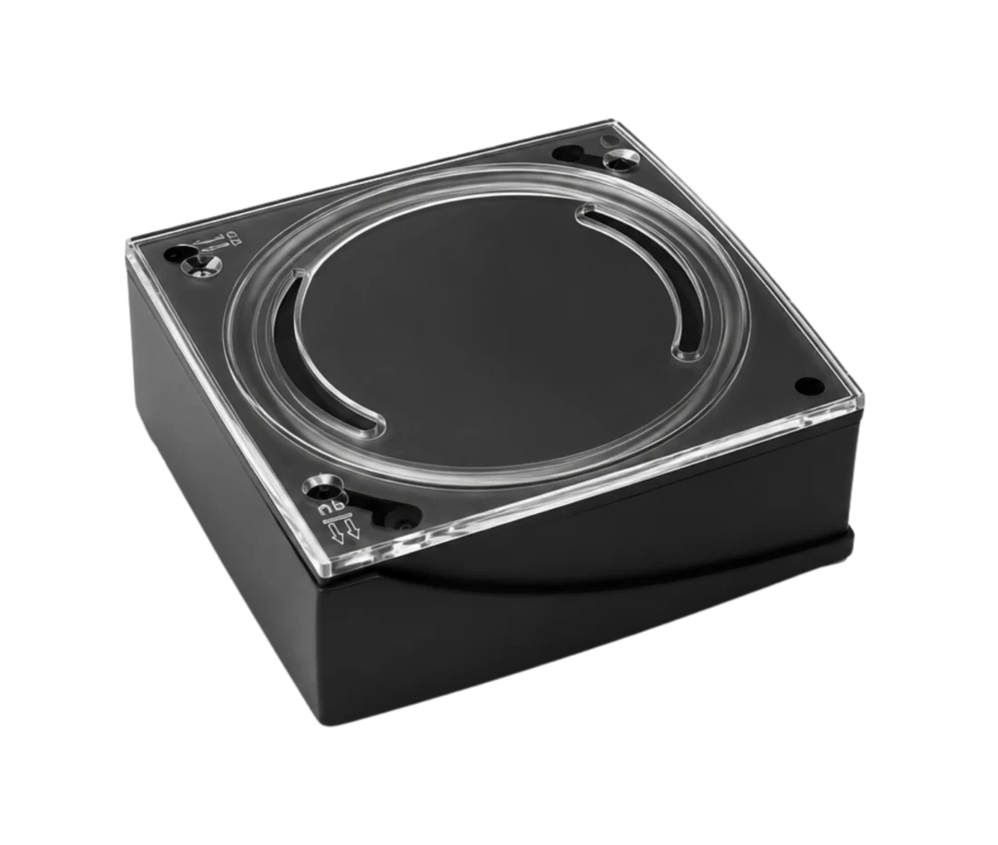 ShadowBeacon RF location transmitter, a black enclosure with a clear protective lid